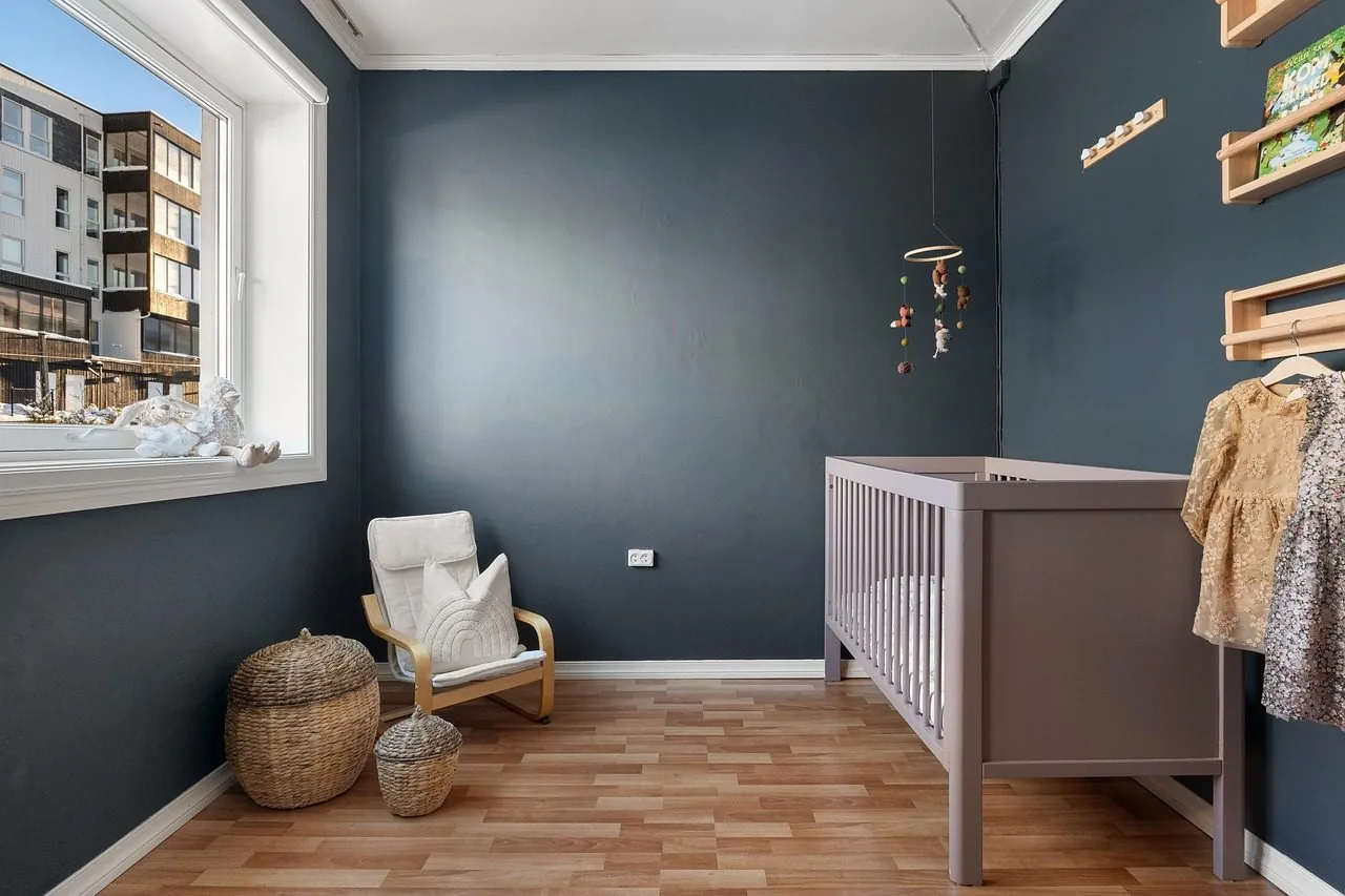 A child's room with a storage frame full of plastic toy bins