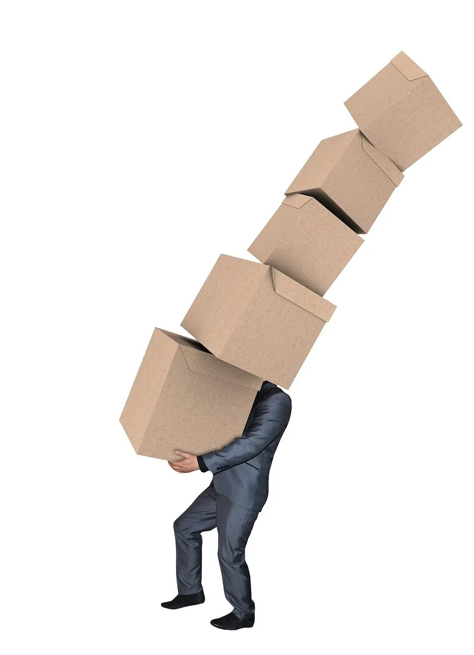 Stacked cardboard moving boxes in an empty room